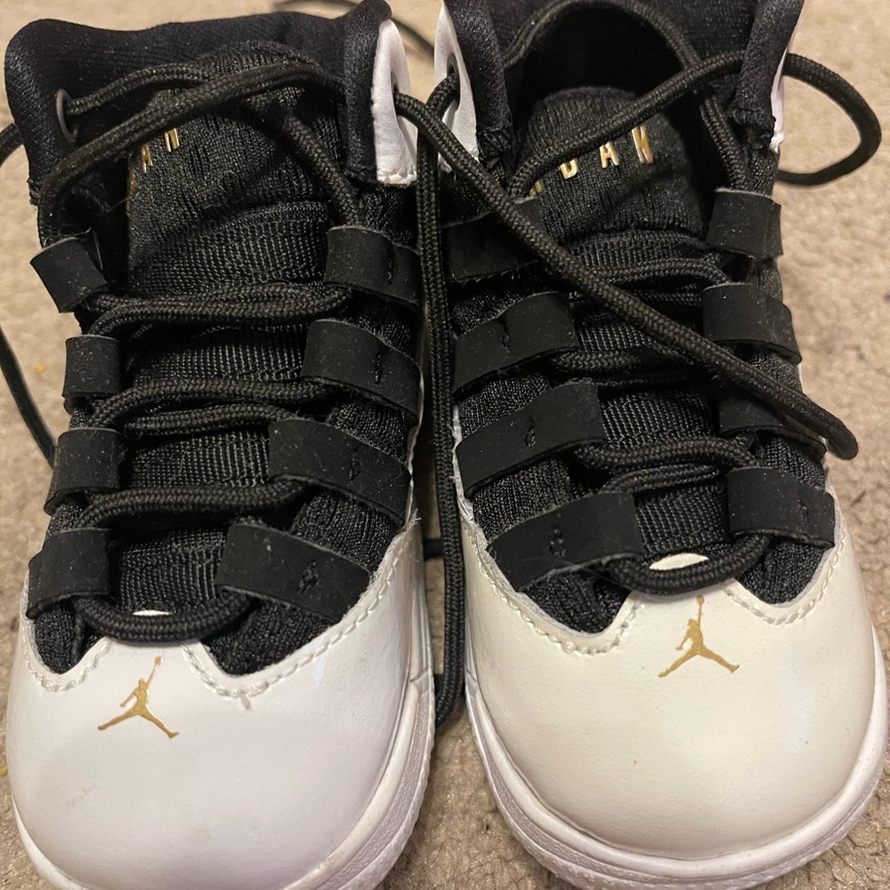 Jordan Kids Black and White Sneakers with Gold Accents